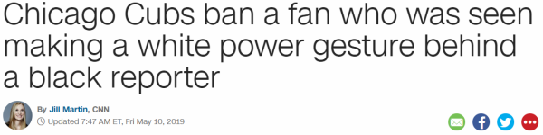 Chicago Cubs ban a fan who was seen making a white power gesture behind a black reporter