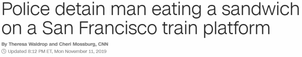 Police detain man eating a sandwich on a San Francisco train platform